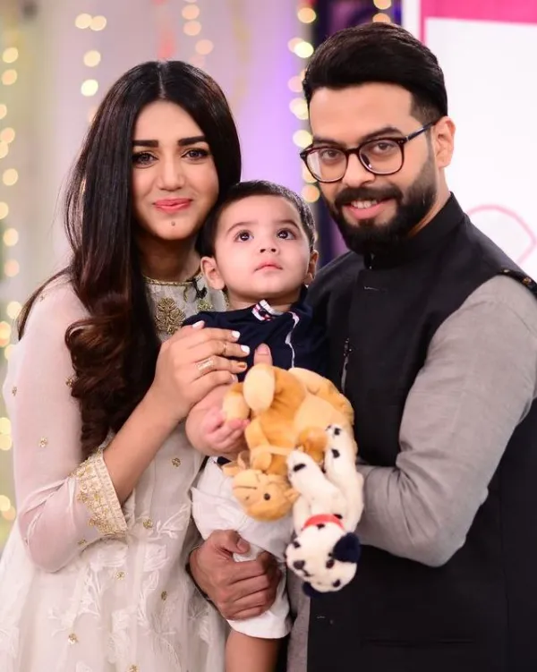 Anum Fayyaz with her husband and son